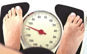large-feet-on-a-weight-scale