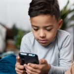 phone-using-kid-2026-02-89c21b90702e3855cda4c0f830f4643d-3x2-1